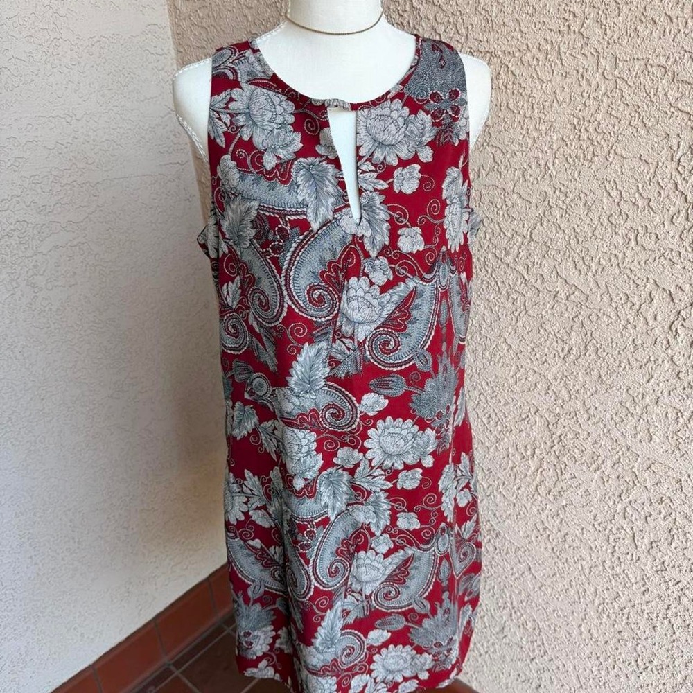 Red and grey paisley print dress with keyhole neckline.